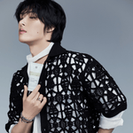 an ATEEZ member holding BRMUD Relief Mud Pack-to-Foam Cleanser – Korean 2-in-1 mud skincare product for deep cleansing